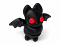 Black 3D printed articulated Baby Bat with red eyes on white background