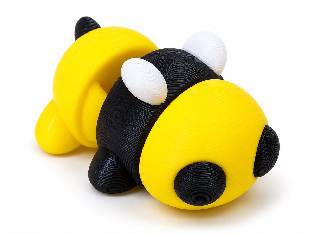 Wiggle3D Flexible Baby Bee articulated 3D printed fidget toy on white background